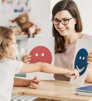 home 23 Therapist and child using emotion flashcards